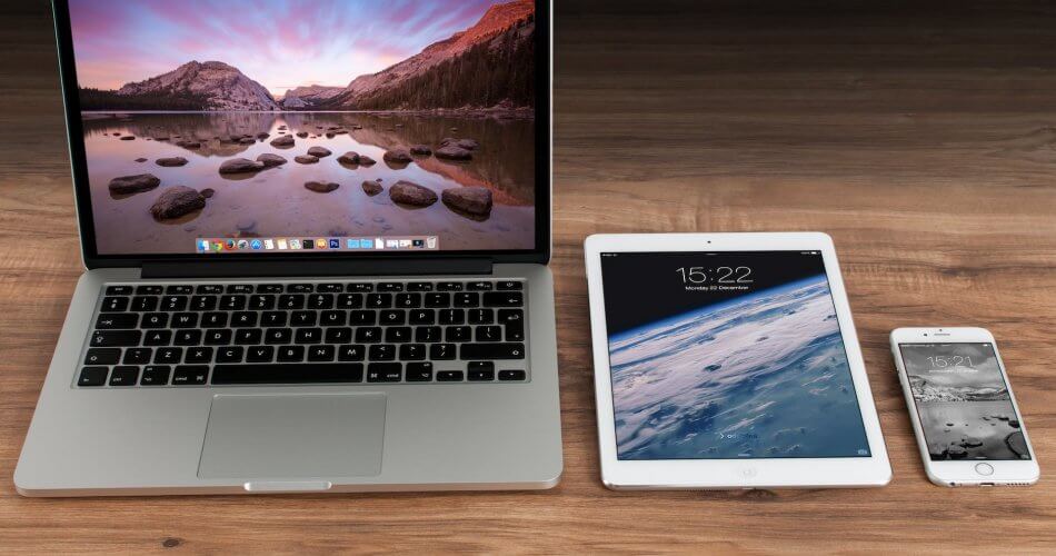 macbook pro beside white ipad